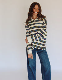 Woman wearing a striped long-sleeve shirt with a white background